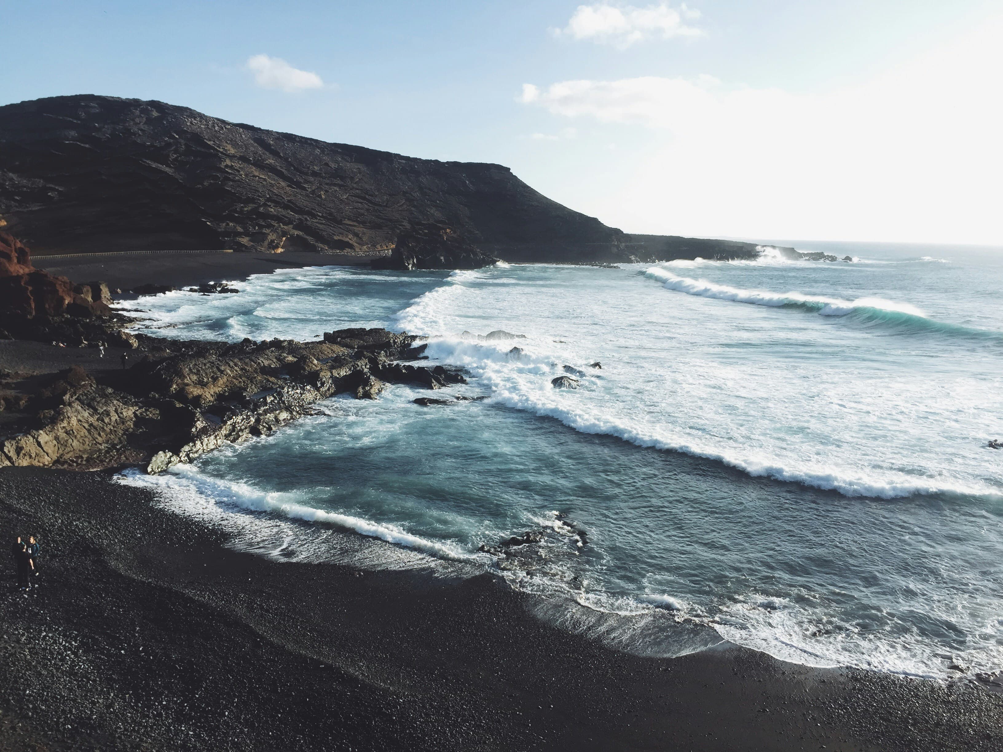 Volcanic landscape of Lanzarote with traditional white architecture and ocean views